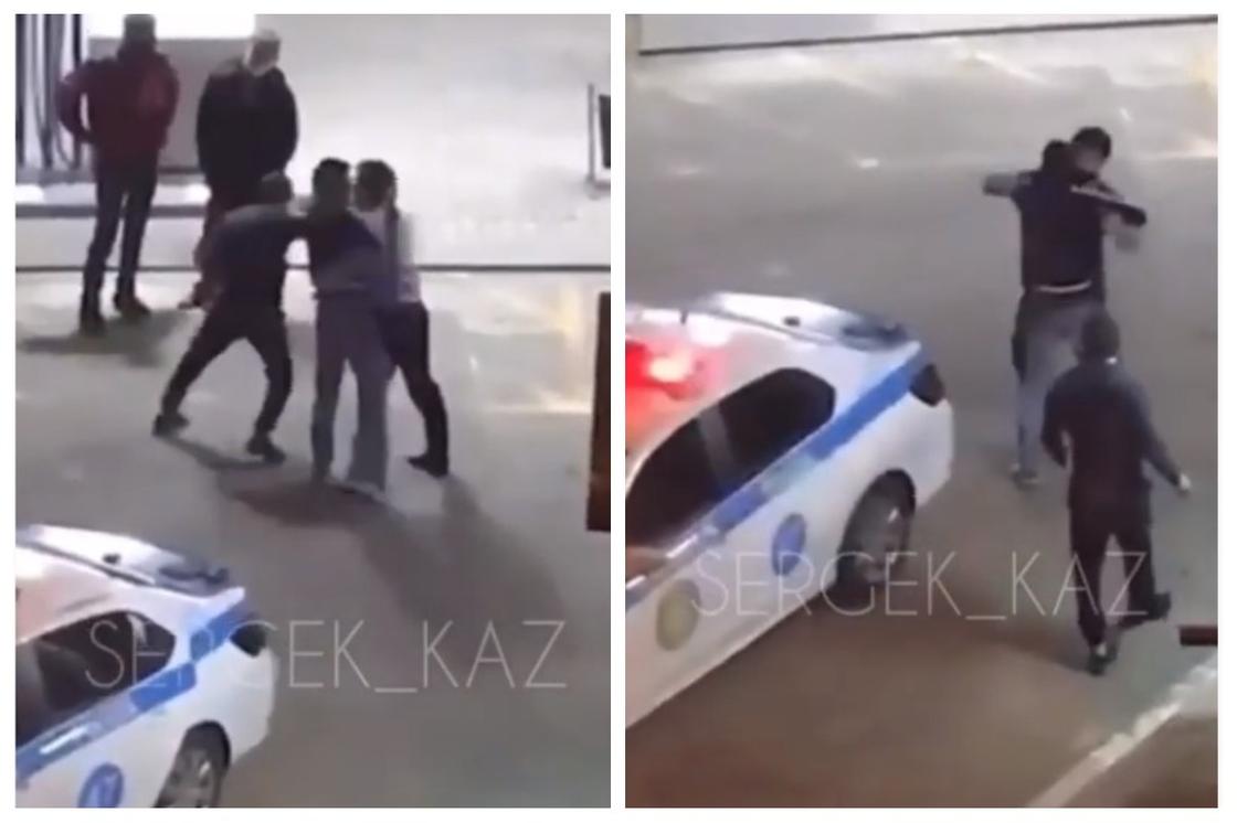 Драку мужчины и полицейского на АЗС сняли на видео в Алматы