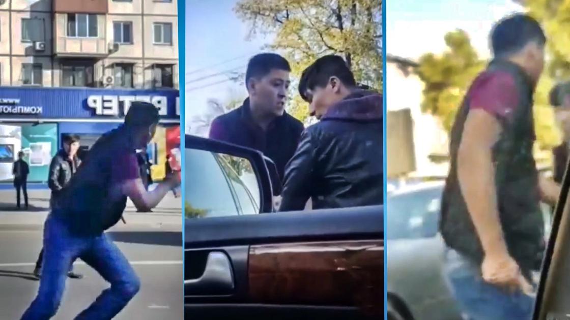 Два водителя напали друг на друга с оружием на дороге в Алматы (видео)