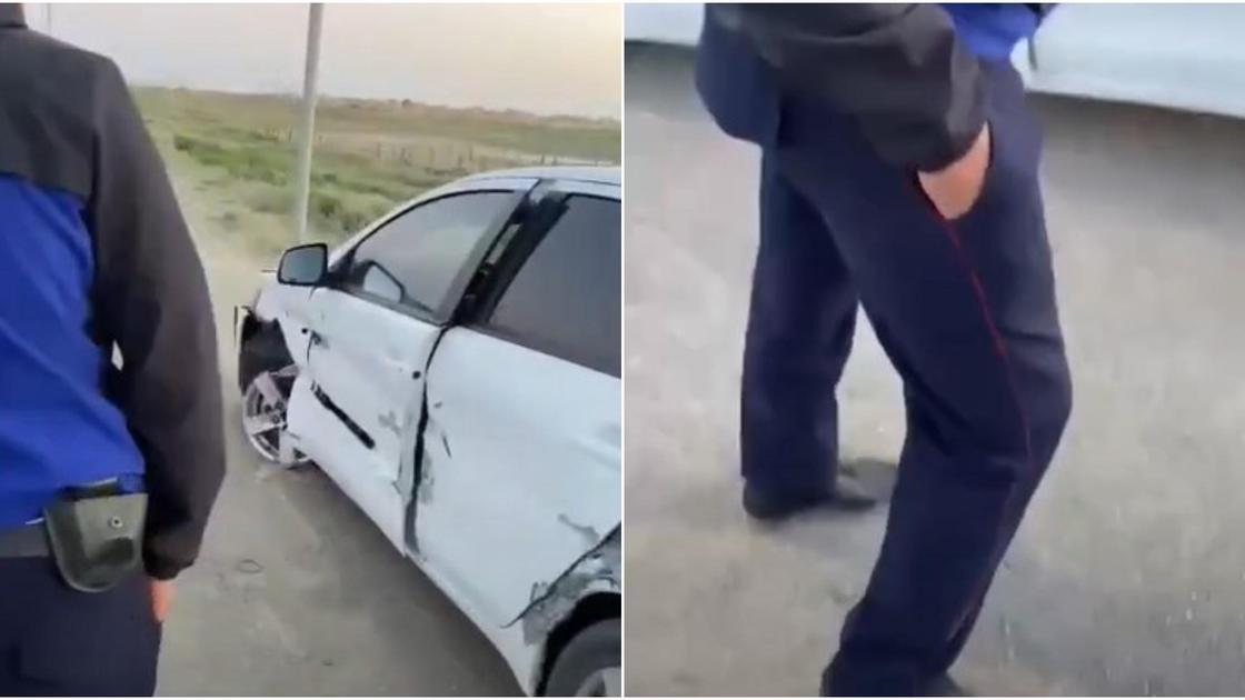 Полицейский возле разбитой машины в Атырауской области