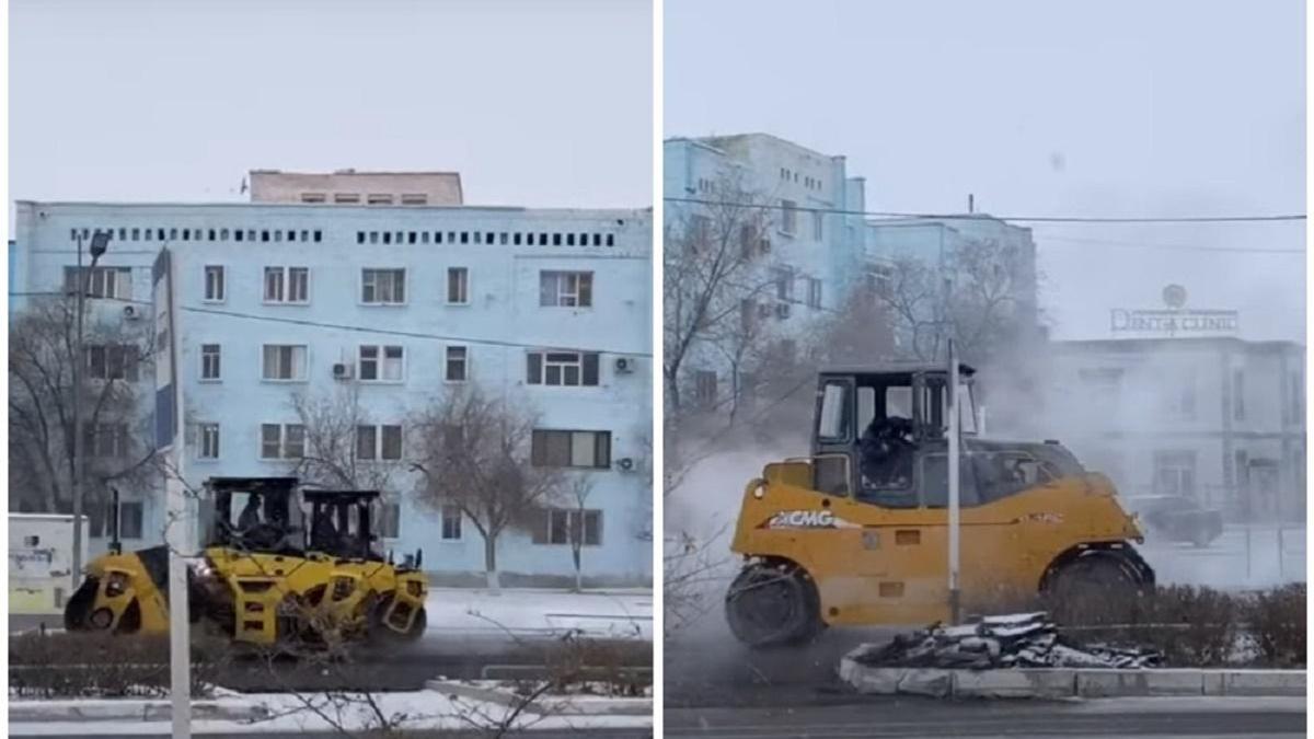 Спецтехника кладет асфальт при снегопаде