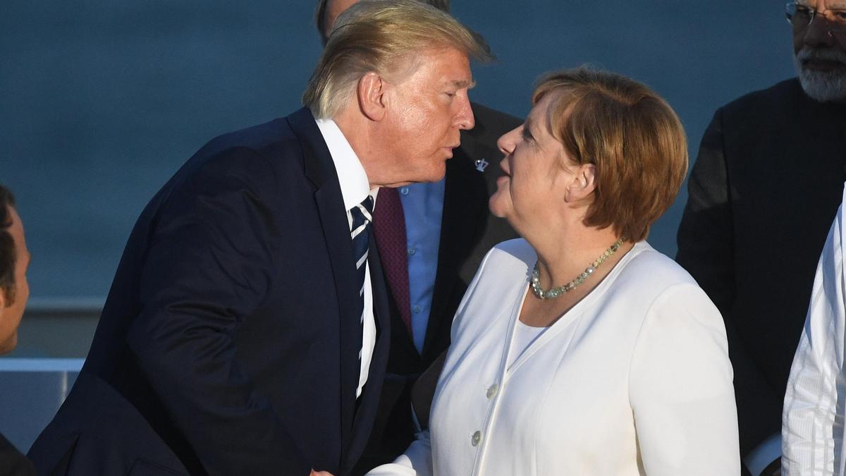 Дональд Трамп и Ангела Меркель Дональд Трамп и Ангела Меркель
