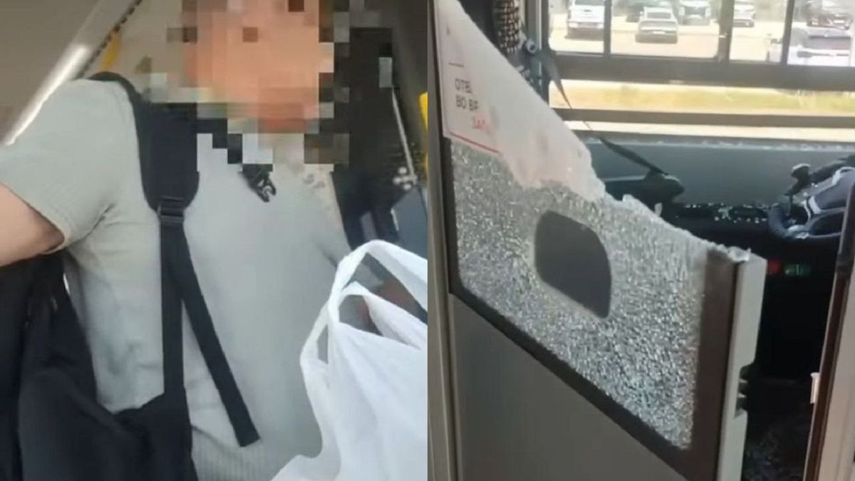 Мужчина и разбитое стекло в автобусе