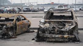 Сгоревшие во время январских беспорядков автомобили