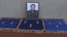Портрет и медали Меиржана Айманова
