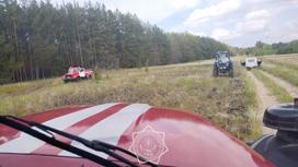 Пожарные и трактор на территории лесничества