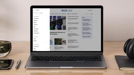 Ноутбук со страницей сайта NUR.KZ