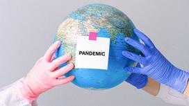 Глобус с надписью пандемия