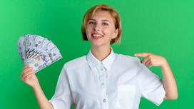 Девушка на зеленом фоне с долларовыми купюрами