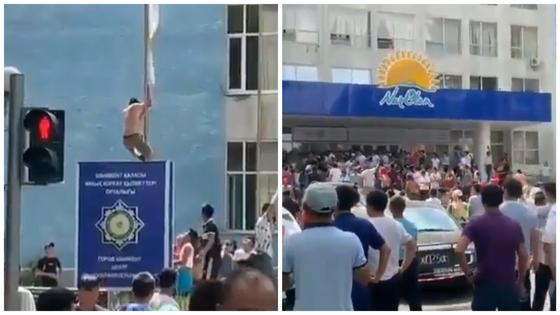 Митингующие жители Арыси пытались сорвать флаг партии Nur Otan (видео) Митингующие жители Арыси пытались сорвать флаг партии Nur Otan (видео)